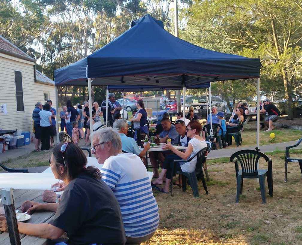 An emotional community get together on Christmas eve 2015 – just six days after the fire.