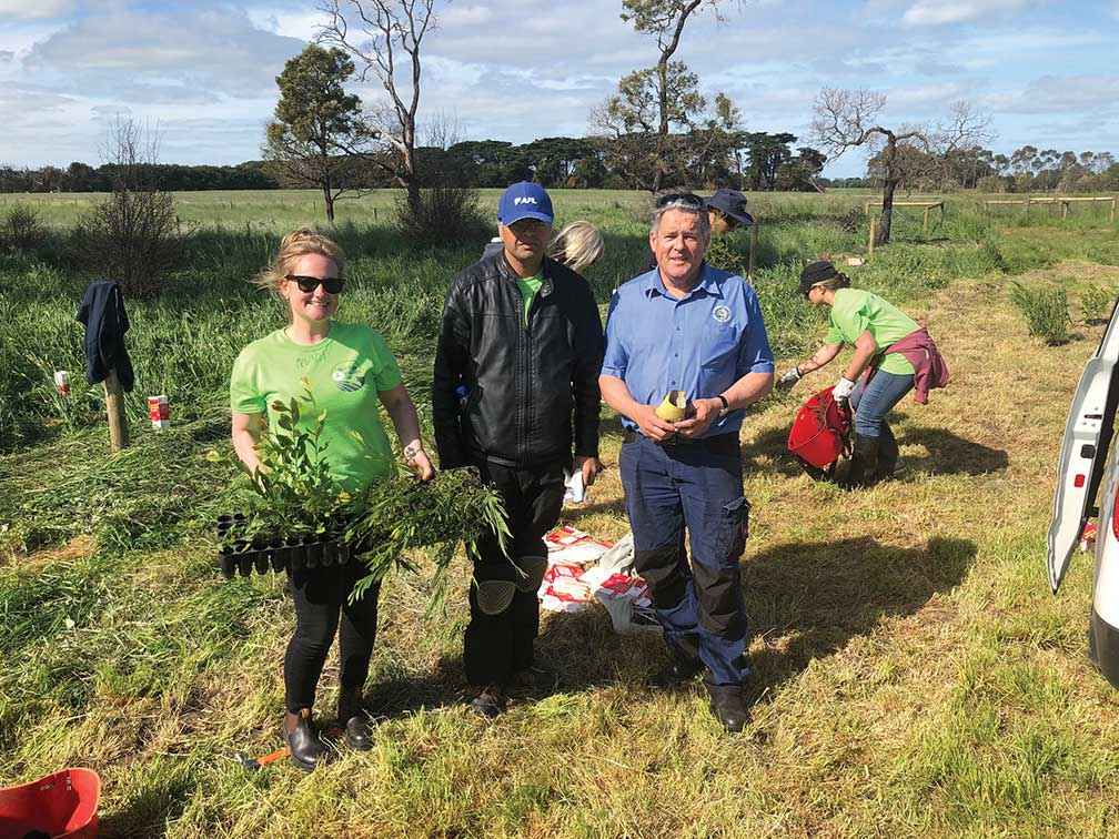 Geoff Rollinson (right) and volunteers at the ReGreen4FireAid event at John and Joy Errey’s farm at Lake Cobrico in October 2018.
