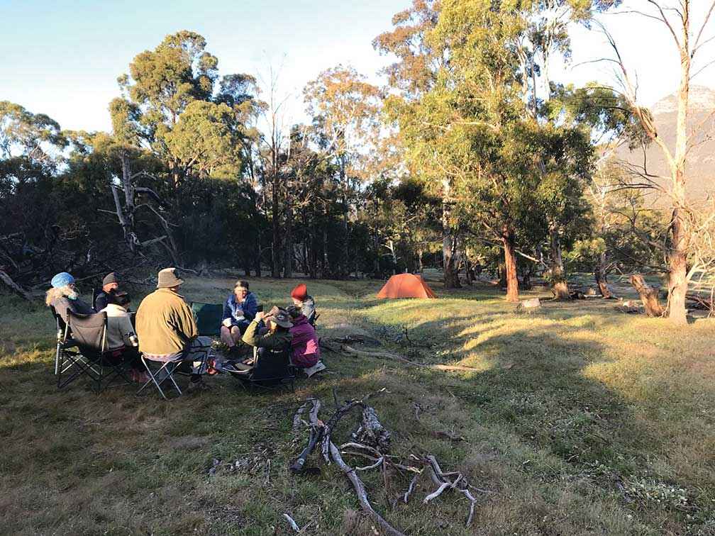 The walkers gathered around the campfire in the evening.