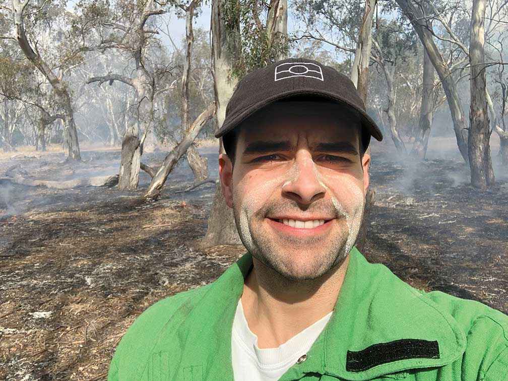 Jackson Chatfield participating in a cultural burn with Barengi Gadjin Land Council on Wotjobaluk Country at Dyurrite (Mt Arapiles) in 2021.