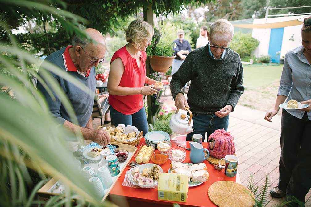 Members of Merriman Creek Landcare Group gather around for the important morning tea.