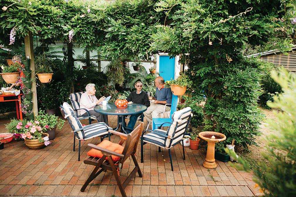 Local Landcare legends Eddie and Pat Brand talk with Peter Garlick (centre). 